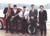 The American Music Company Band circa 1985.  Left to right: John Broaddus (sax), Ernie Gorospe (bass), Danny Gatton (guitar), Jerry Wallmark (drums), Billy Windsor (vocal, guitar).  Photo taken on the Piscataway river - actually, a creek - not far from Danny's home in Accokeek, Maryland.