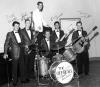 The Offbeats circa 1960.  Left to right: Dick Heintze (Hammond B3), John Broaddus (sax), Ronnie MacDonald (vocal), Jerry Wallmark (drums), Ernie Gorospe (bass), Danny Gatton (guitar).  Photo taken at studio during recording of 'Beggarman' and 'Trouble in Mind'.